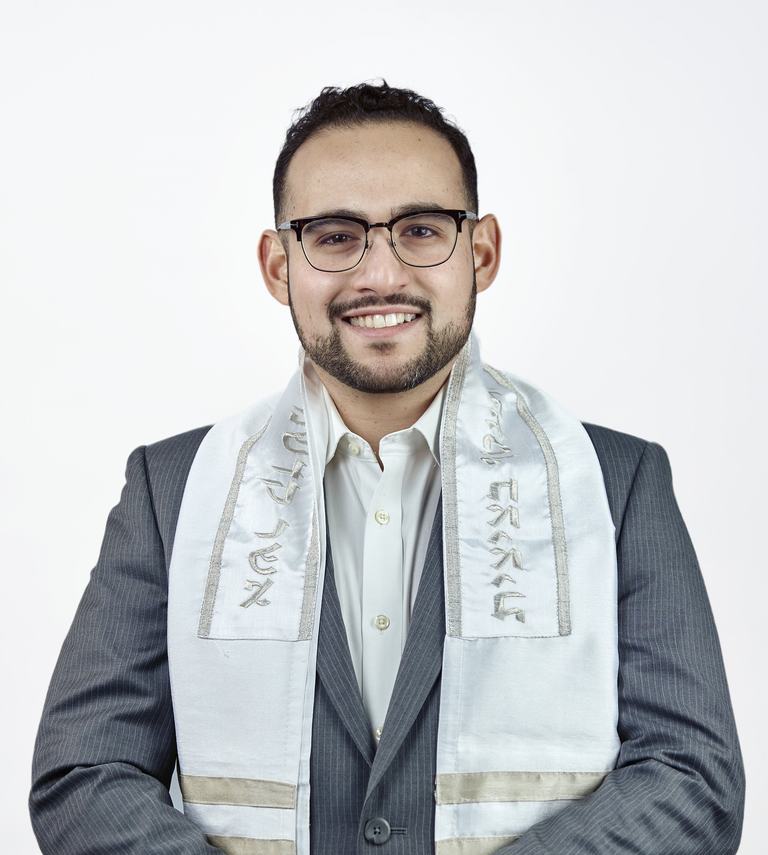 Todd Bronshtein, wedding officiant and founder of Modern Mazel, wearing a tallit